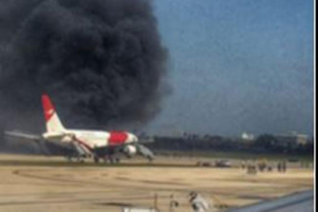 A Dynamic International Airways plane after it apparently caught fire on the runway in Fort Lauderdale, Florida, Thursday, Oct. 29, 2015. (CNN)