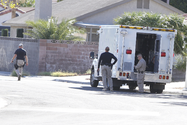 Las Vegas police are investigating a barricade situation where three people are dead after a shooting in a southeast valley neighborhood Friday, Oct. 2, 2015 in the 7200 block of Hardtack Circle, ...