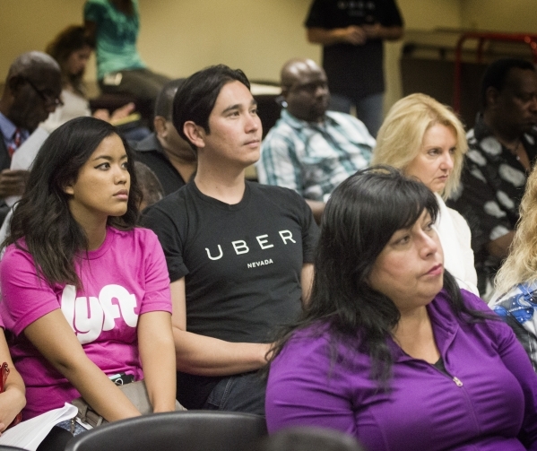 Racquel Aniag, left  and Uber marketing manager Kris Cuaresma-Primm listens during the Nevada Transportation Authority workshop at Grant Sawyer Building,555 E Washington Avenue, on Thursday, July  ...