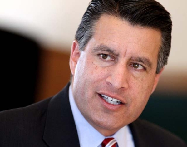 Nevada Gov. Brian Sandoval works in the Board of Examiners meeting at the Capitol, in Carson City, Nev., on Tuesday Jan. 8, 2013. ° (Cathleen Allison/Las Vegas Review-Journal)