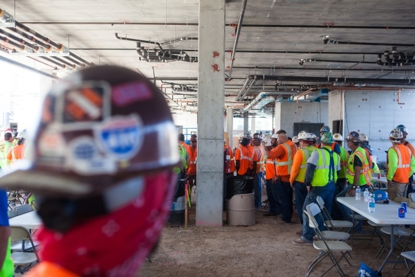 Construction workers gather before the "topping off" ceremony at the Lucky Dragon hotel-casino in Las Vegas on Friday, Sept. 11, 2015. Chase Stevens/Las Vegas Review-Journal Follow @csst ...