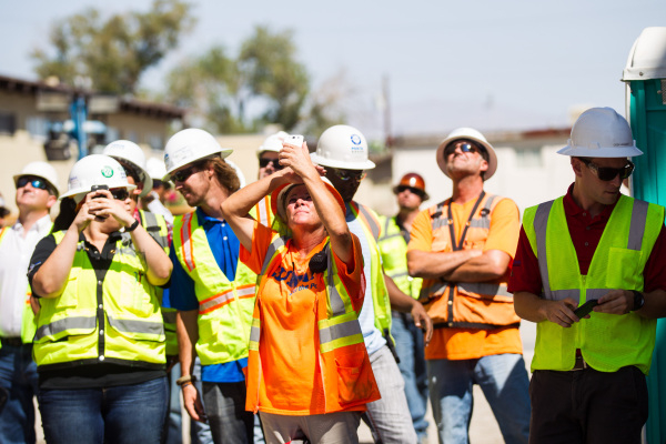 Construction workers watch the "topping off" ceremony at the Lucky Dragon hotel-casino in Las Vegas on Friday, Sept. 11, 2015. Chase Stevens/Las Vegas Review-Journal Follow @csstevensphoto