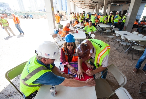 Lin Huang gets a t-shirt signed following the "topping off" ceremony at the Lucky Dragon hotel-casino in Las Vegas on Friday, Sept. 11, 2015. Chase Stevens/Las Vegas Review-Journal Follo ...