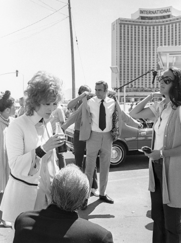 Production of the James Bond movie "Diamonds Are Forever" starring Sean Connery, center, and Jill St. John, left, in front of the International Hotel and Casino, (later the Las Vegas Hi ...