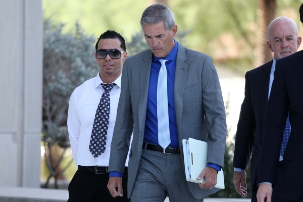 Ernesto Joshua Ramos, left, walks to Lloyd George Federal Courthouse in Las Vegas with his attorney Gabriel Grasso to plead guilty to an extortion charge Tuesday, Nov. 3, 2015. Erik Verduzco/Las V ...
