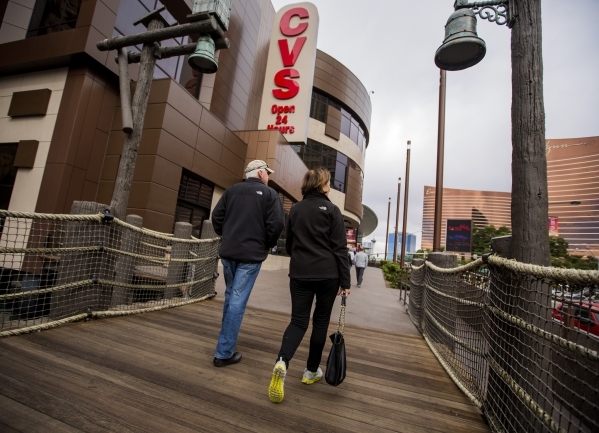 A couple walks pass the CVS store at Treasure Island on Tuesday, Nov. 10, 2015. The Treasure Island announced that  Marvel Comics will open a two story store above CVS Pharmacy based on the Adveng ...
