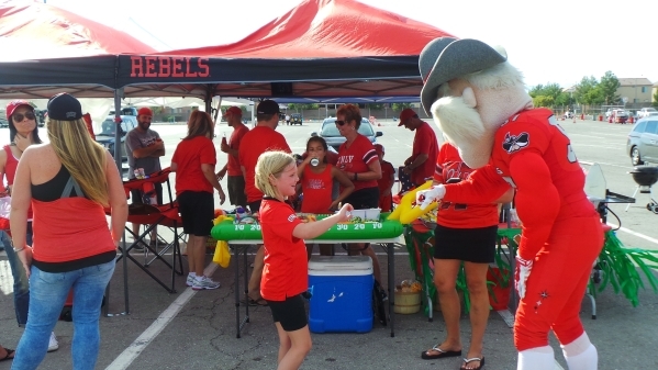 UNLV‘s mascot Hey Reb greets people partaking in last years tailgate party on Oct. 10 2014 that marked the culmination of the sesons Plastic Food Drive benefitting the Nevada Partnership for ...