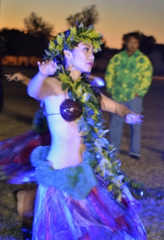 Hokulani Keali‘inohomoku of Hot Lava performs during a luau celebrating the announcement of Natalia RuizþÃôs Make-A-Wish Foundation trip to Hawaii at Lewis Park at 1970 Tree Line Dr ...