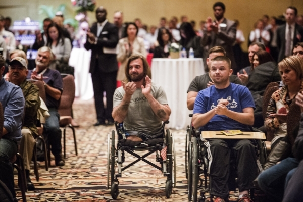 Wound Warriors and guest clap during the "Salute the Troops" event at the The Mirage on Friday, Nov. 13, 2015. MGM Resorts International is treating more than 70 wounded warriors who suf ...