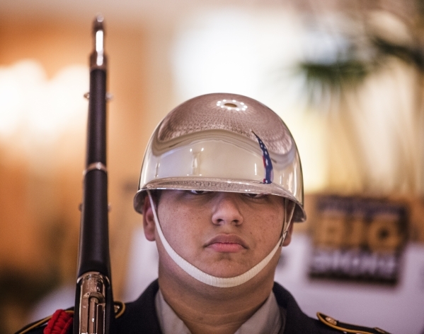Tom Elias with the  Valley High School JRROTC stands to attention during the "Salute the Troops" event at the The Mirage on Friday, Nov. 13, 2015.MGM Resorts International is treating mo ...