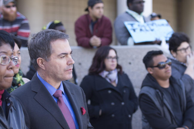 UNLV President Len Jessup, left, listens as UNLV students hold a demonstration in front of  the Franklin J. Koch Auditorium at UNLV to show support of the University of Missouri and Yale Universit ...