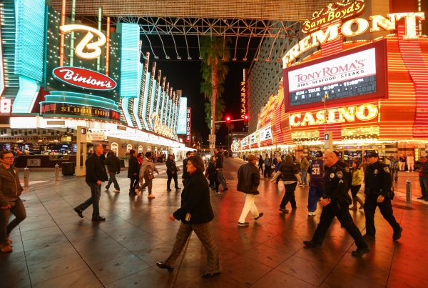 Las Vegas City Manager Betsy Fretwell, center, walks the Fremont Street Experience in downtown Las Vegas on Tuesday, Nov. 17, 2015. Tuesday was the first day of the city‘s new ordinance requ ...