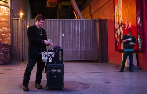 Magician Sean Scott, left, sets up at a new location zone on the Fremont Street Experience in downtown Las Vegas on Tuesday, Nov. 17, 2015. Tuesday was the first day of the city‘s new ordina ...