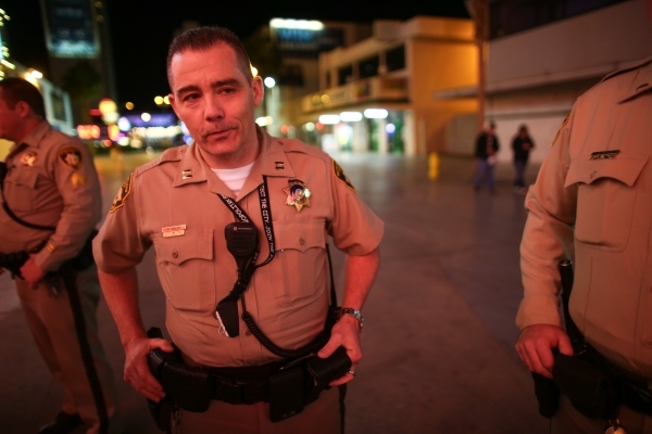Las Vegas police captain Andrew Walsh is shown around the Fremont Street Experience in downtown Las Vegas on Tuesday, Nov. 17, 2015. Tuesday was the first day of the city‘s new ordinance req ...