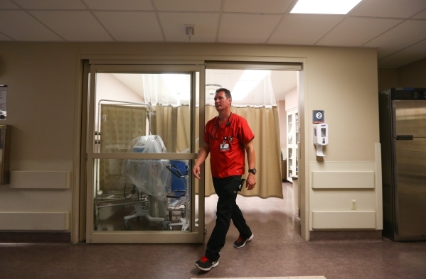 Nurse Jamey Fields walks into a hallway after checking on a patient in the emergency room at Southern Hills Medical Center in Las Vegas on Tuesday, Nov. 17, 2015. Chase Stevens/Las Vegas Review-Jo ...
