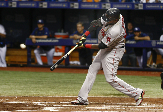 Sep 12, 2015; St. Petersburg, FL, USA; Boston Red Sox designated hitter David Ortiz (34) hits his 500th home run during the fifth inning of a baseball game against the Tampa Bay Rays at Tropicana  ...