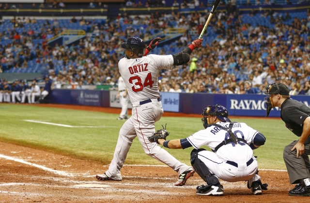 Sep 12, 2015; St. Petersburg, FL, USA; Boston Red Sox designated hitter David Ortiz (34) hits a single to center during the seventh inning of a baseball game against the Tampa Bay Rays at Tropican ...