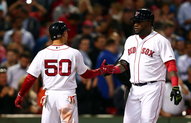 Sep 24, 2015; Boston, MA, USA; Boston Red Sox designated hitter David Ortiz (R) celebrates his home run against the Tampa Bay Rays with center fielder Mookie Betts (50) during the first inning at  ...