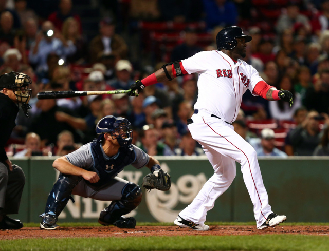 Sep 24, 2015; Boston, MA, USA; Boston Red Sox designated hitter David Ortiz (34) hits a home run against the Tampa Bay Rays during the first inning at Fenway Park. (Mark L. Baer/USA Today Sports)
