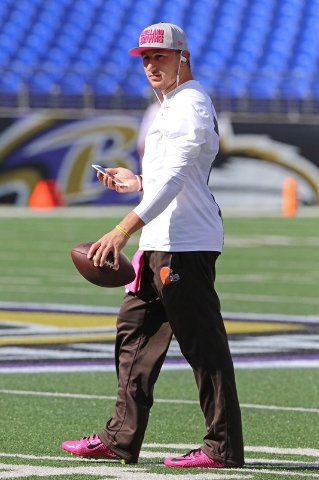 Oct 11, 2015; Baltimore, MD, USA; Cleveland Browns quarterback Johnny Manziel (2) checks his phone during warms up before a game against the Baltimore Ravens at M&T Bank Stadium. Mandatory (Mi ...