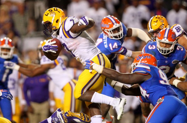 Oct 17, 2015; Baton Rouge, LA, USA; LSU Tigers running back Leonard Fournette (7) is tackled by Florida Gators defensive lineman Bryan Cox (94) in the second half at Tiger Stadium. LSU defeated Fl ...