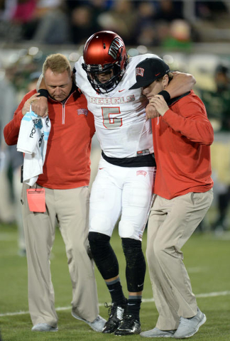 UNLV Rebels quarterback Blake Decker (5) is removed from the field due to a lower leg injury in the second quarter against the Colorado State Rams at Sonny Lubick Field at Hughes Stadium. Mandator ...