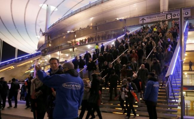 Crowds leave the Stade de France where explosions were reported to have detonated outside the stadium during the France vs German friendly match near Paris, November 13, 2015. (Gonazlo Fuentes/Reu ...
