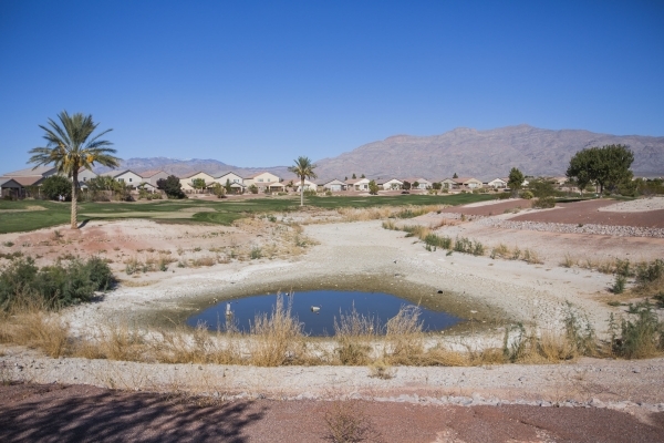 A partially filled lake at the recently closed Silverstone Golf Course, 8600 Cupp Drive is seen Wednesday, Nov. 12, 2015. A federal court judge ruled in favor of  Silverstone Ranch homeowners and  ...