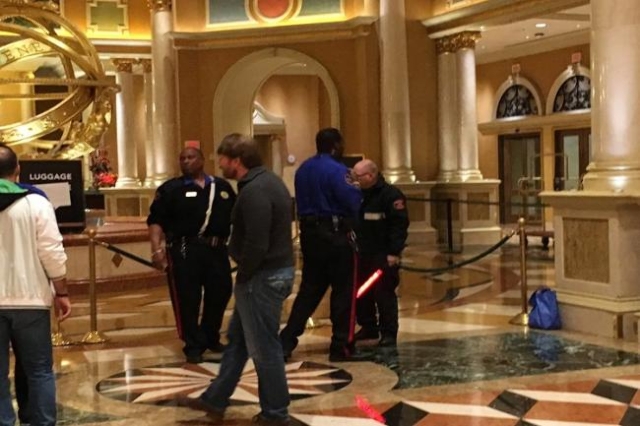Security guards stop people from exiting the Venetian late Saturday night  after a man jumped from a pedestrian bridge near the Strip. (Las Vegas  Review-Journal/Eric Hartley) | Las Vegas Review-Journal