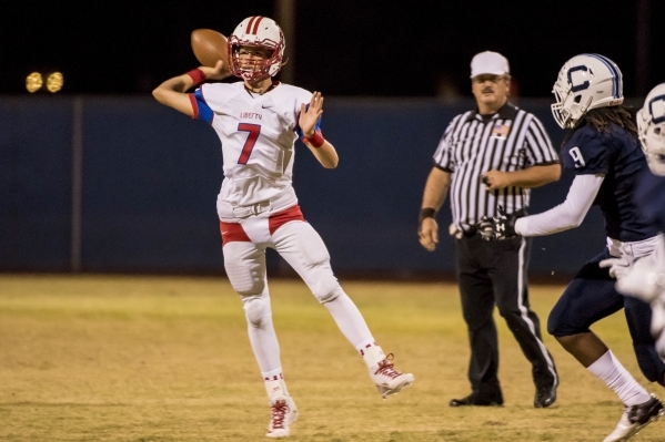 Liberty Patriots quarterback Kenyon Oblad (7) throws the ball against the Centennial Bulldogs at Carol Leavitt Stadium at Centennial High School in Las Vegas on Friday, Sept. 18, 2015. Joshua Dahl ...