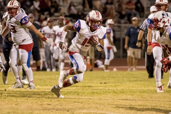 Liberty Patriots runningback Stephon Stowers (15) runs with the ball against the Centennial Bulldogs at Carol Leavitt Stadium at Centennial High School in Las Vegas on Friday, Sept. 18, 2015. Josh ...
