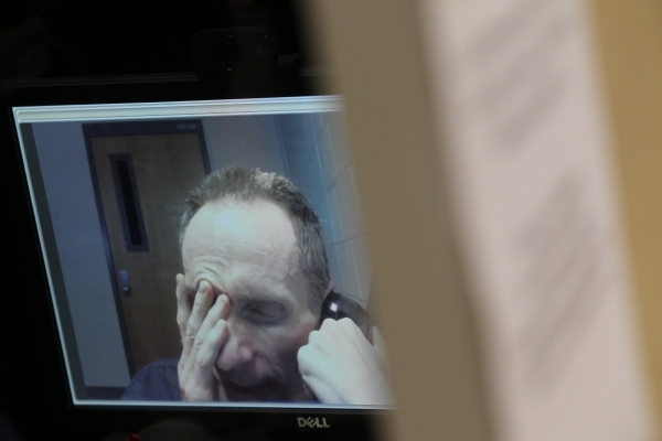 Rick Van Thiel, booked at Clark County Detention Center for charges including acting as a medical practitioner without a license, and possessing a gun by a prohibited person, speaks during an inte ...
