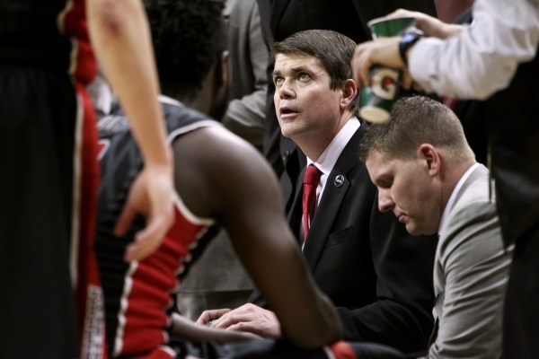 UNLV head coach Dave Rice talks to his players during a timeout during the second half of a Mountain West Conference tournament quarterfinal against San Diego State on March 12, 2015, at the Thoma ...
