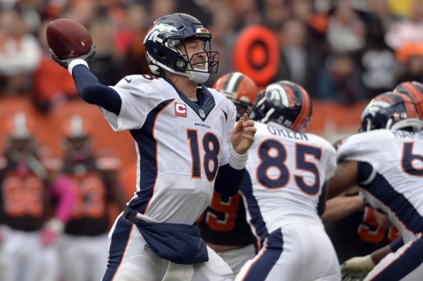Oct 18, 2015; Cleveland, OH, USA; Denver Broncos quarterback Peyton Manning (18) throws a pass during the second half against the Cleveland Browns at FirstEnergy Stadium. The Broncos won 26-23. Ma ...