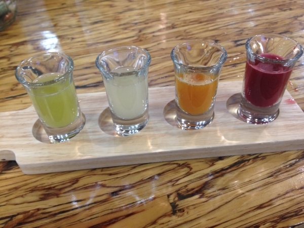 Samples of, from left, Beyond, Flow, Golden and Sweet Beet juices are seen Nov. 16 at Elevated Juice, 7703 N. El Capitan Way No. 140. Sandy Lopez/View