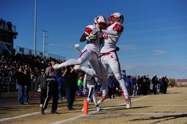Liberty wide receiver Bryan Roland and tight end Damian Nunez (20) celebrate Nunez‘s touchdown against Basic in the second half of the NIAA Division 1 Sunrise Region Football Final prep foot ...