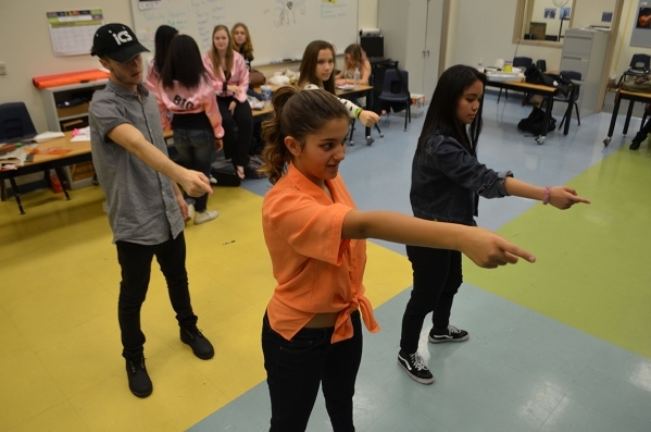 The chorus for "You‘re a Good Man, Charlie Brown" rehearses the "Super Time" dance number backstage at Desert Oasis High School Nov. 19, 2015. Ginger Meurer/Special to View