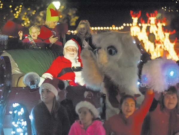 Santa Claus and Jingle Cat wave to the audience during Santa‘s Electric Light parade Saturday Decem er 6, 2014. Steve Andrascik/Boulder City Review