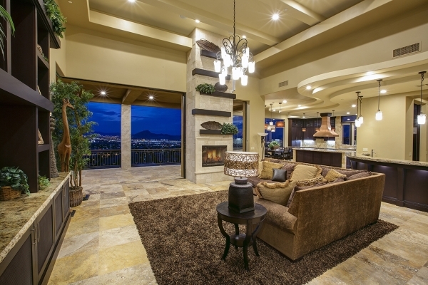 The home at 1504 View Field Court in MacDonald Highlands features a living room with views of the Las Vegas Valley. It‘s listed at nearly $3.9 million. COURTESY