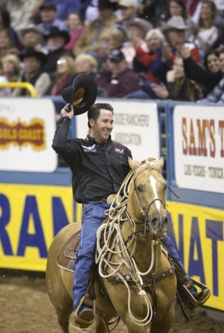 K.M. CANNON/LAS VEGAS REVIEW-JOURNAL Trevor Brazile of Decatur, Texas, acknowledges the crowd after competing in calf roping on the final night of the 10-day National Finals Rodeo at the Thomas &a ...