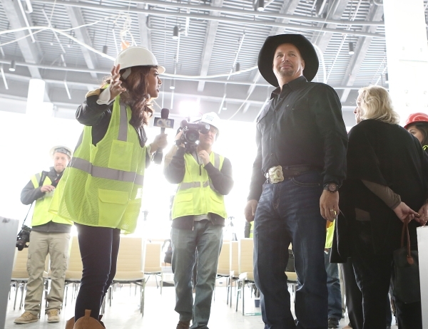Artist Garth Brooks, right, listens reporter‘s questions at the new Las Vegas MGM-AEG Arena during a press conference on Thursday, Dec. 3, 2015. Brooks discussed his plans for 2016 Las Vegas ...