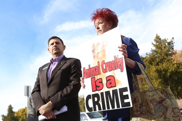 State Sen. Mark Manendo, left, and Stacia Newman, president of the Nevada Political Action for Animals,  speak at a rally at the Boulder City Police Department to demand a case of animal cruelty a ...