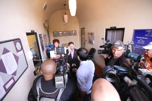 State Sen. Mark Manendo attempts to call the police chief at a rally at the Boulder City Police Department to demand a case of animal cruelty against former Animal Control Supervisor Mary Jo Frazi ...