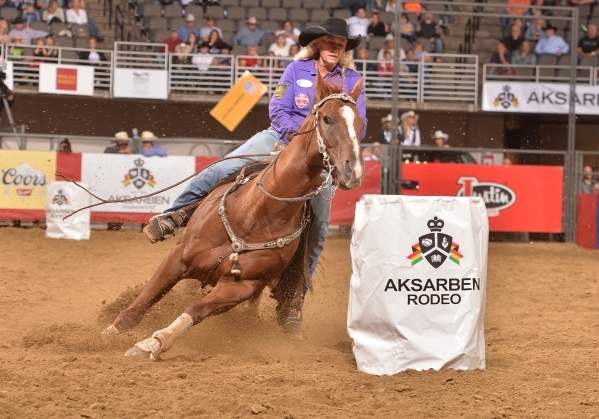Vickie Carter, aboard Blaze, rounds a barrel while competing at a rodeo in Omaha, Neb., earlier this year. Carter, 60, in her first full season on the WPRA tour, qualified for the Wrangler Nationa ...
