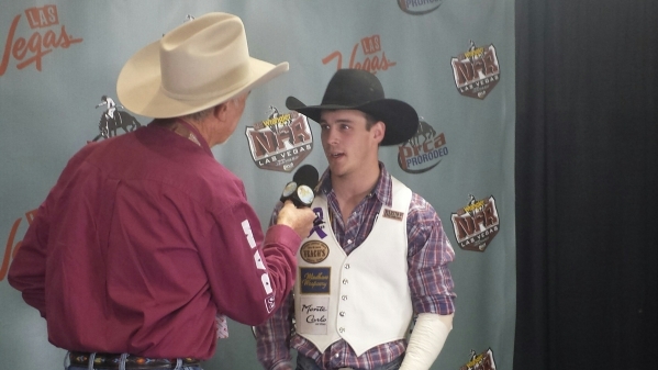 Tim O‘Connell makes the rounds with the media after winning the first go-round of bareback riding on opening night of the Wrangler National Finals Rodeo on Thursday at the Thomas & Mack  ...