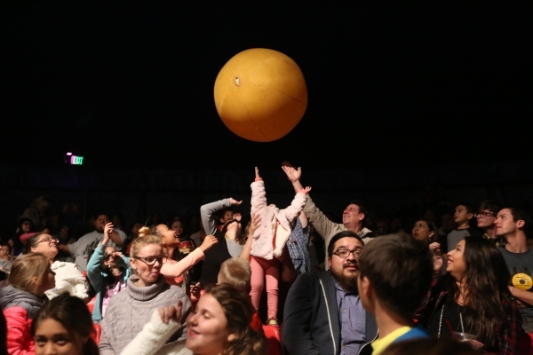 The crowd tries to keep a giant ball from touching the ground during the opening night of Circus Vargas at the Meadows Mall parking lot in Las Vegas Thursday, Dec. 11, 2015. Rachel Aston/Las Vegas ...