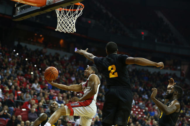 UNLV guard Jerome Seagears (2) drives to shoot the ball against Arizona State forward Willie Atwood (2) during a basketball game at the Thomas & Mack Center in Las Vegas on Wednesday, Dec. 16, ...