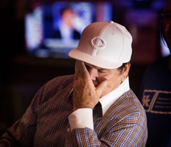 Major League Baseball all-time hits leader Pete Rose wipes his face while watching MLB Network inside Pete Rose Sports Bar and Grill, 3743 S Las Vegas Boulevard, after he conducted  a press confer ...