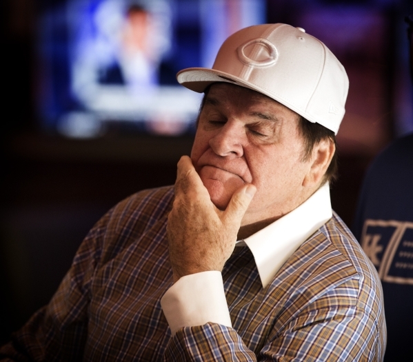 Major League Baseball all-time hits leader Pete Rose wipes his face while watching MLB Network inside Pete Rose Sports Bar and Grill, 3743 S Las Vegas Boulevard, after he conducted a press confer ...