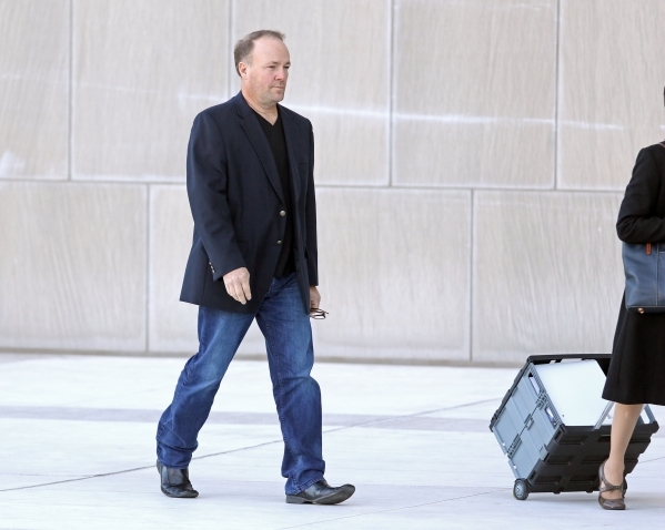 Former Las Vegas mortgage broker Steven Grimm enters Lloyd George U.S. Courthouse Wednesday, Dec. 16, 2015, in Las Vegas. Grimm appeared before U.S. District Judge James Mahan regarding his involv ...